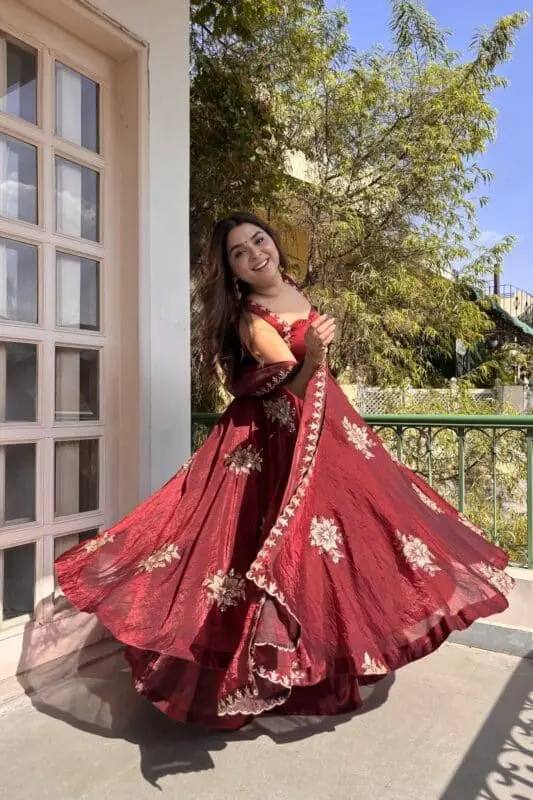 Model twirling in wine embroidered Anarkali palazzo set with dupatta for festive and wedding styling