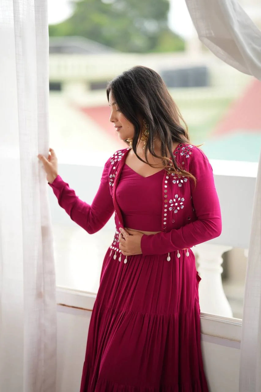 wine lehenga with koti side view showing mirror embroidery jacket and tiered skirt