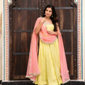 yellow crepe anarkali with peach dupatta side drape festive look