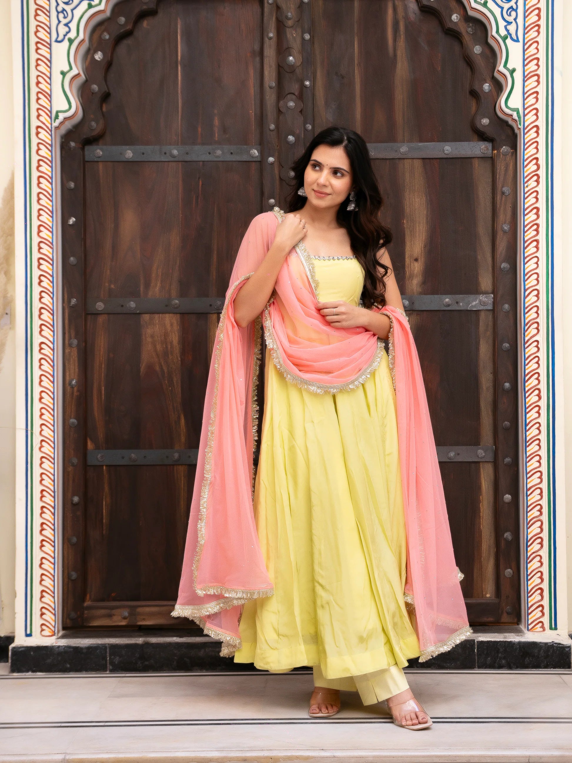 yellow crepe anarkali with peach dupatta side drape festive look