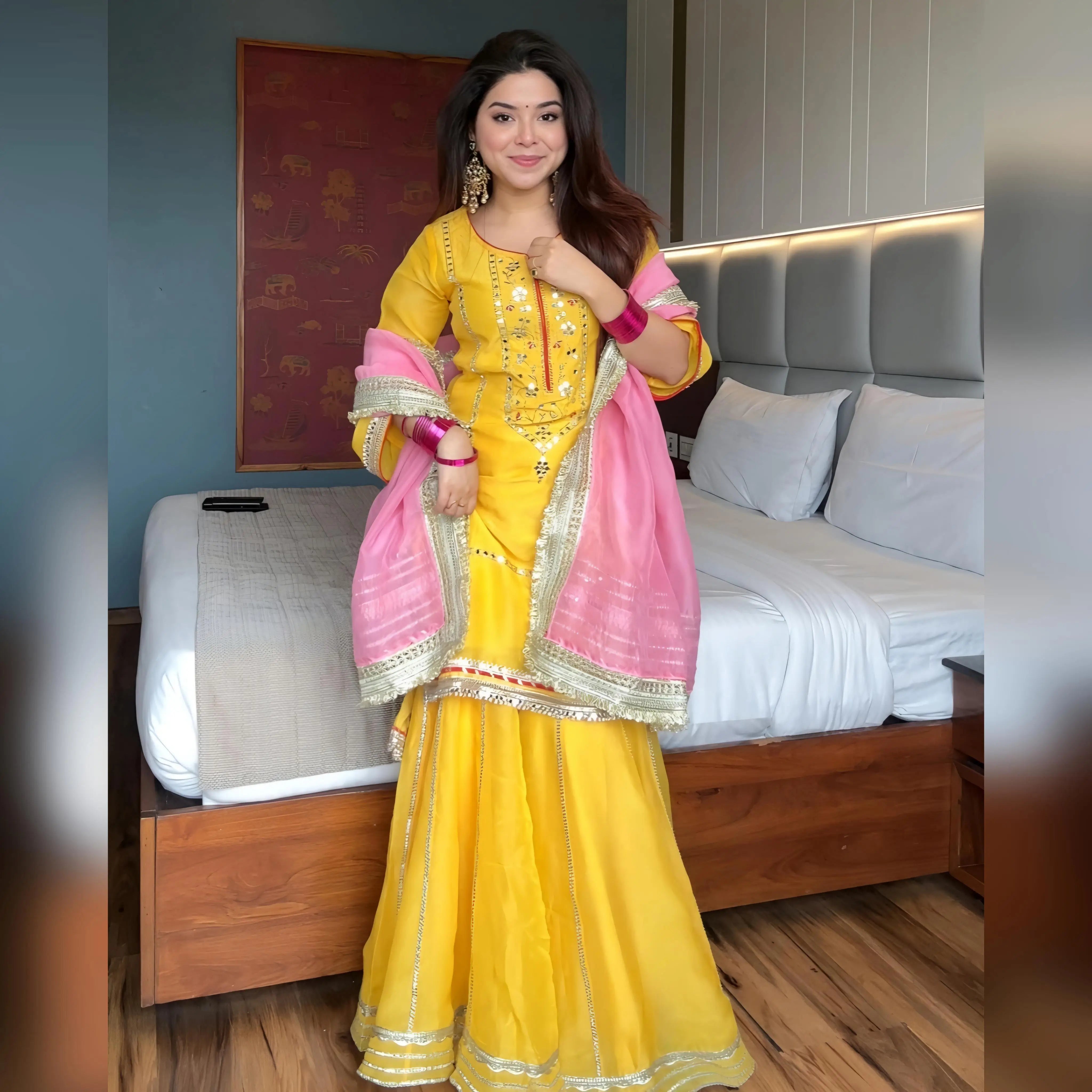 Yellow sharara set with pink gota patti dupatta wide-leg flounced sharara